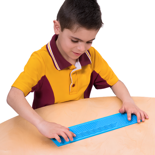 Child using a busy fingers tactile ruler on a table with a white background